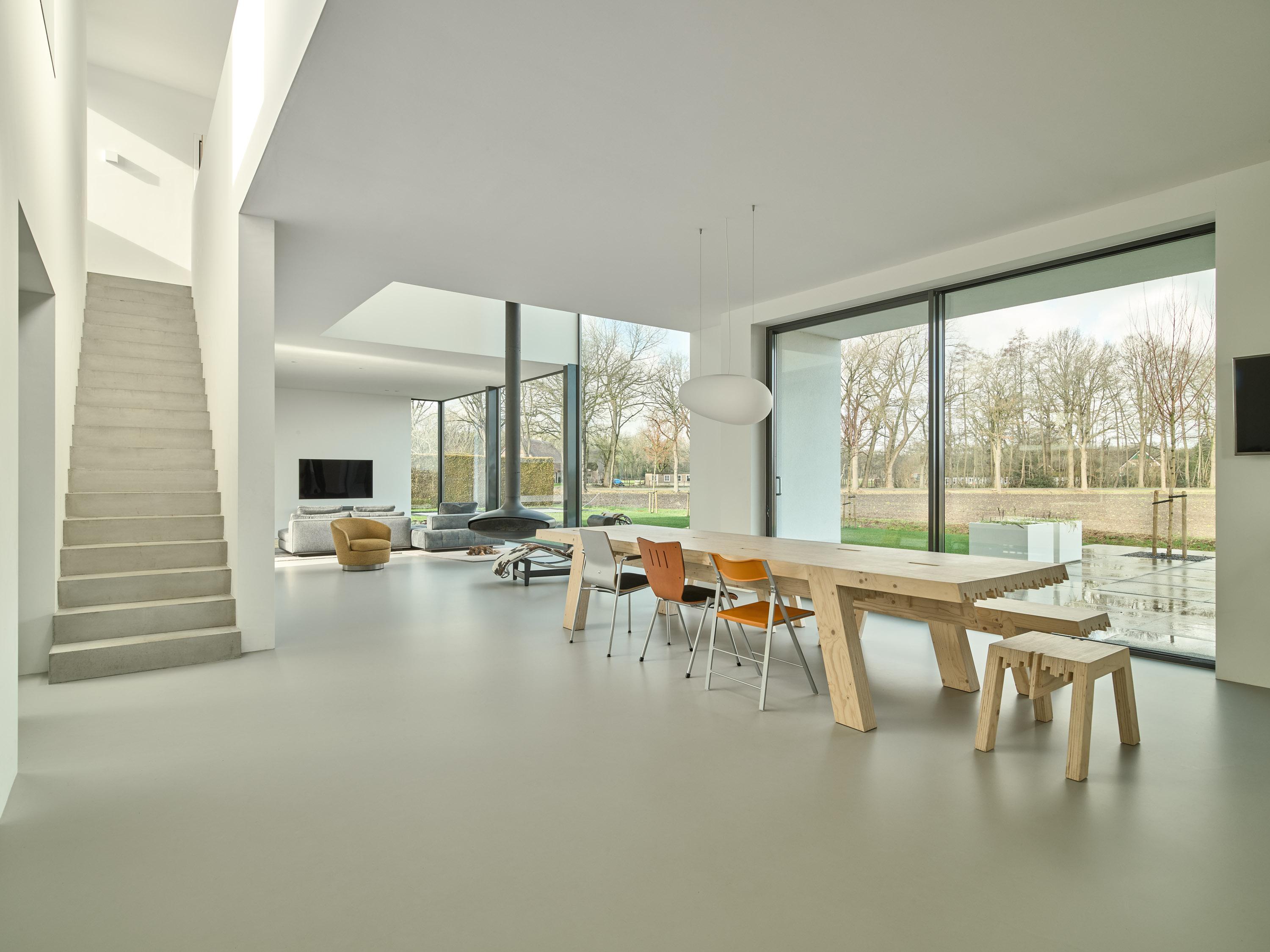 Stylish hotel lounge with Acosorb acoustic ceiling creating a quiet and relaxing atmosphere