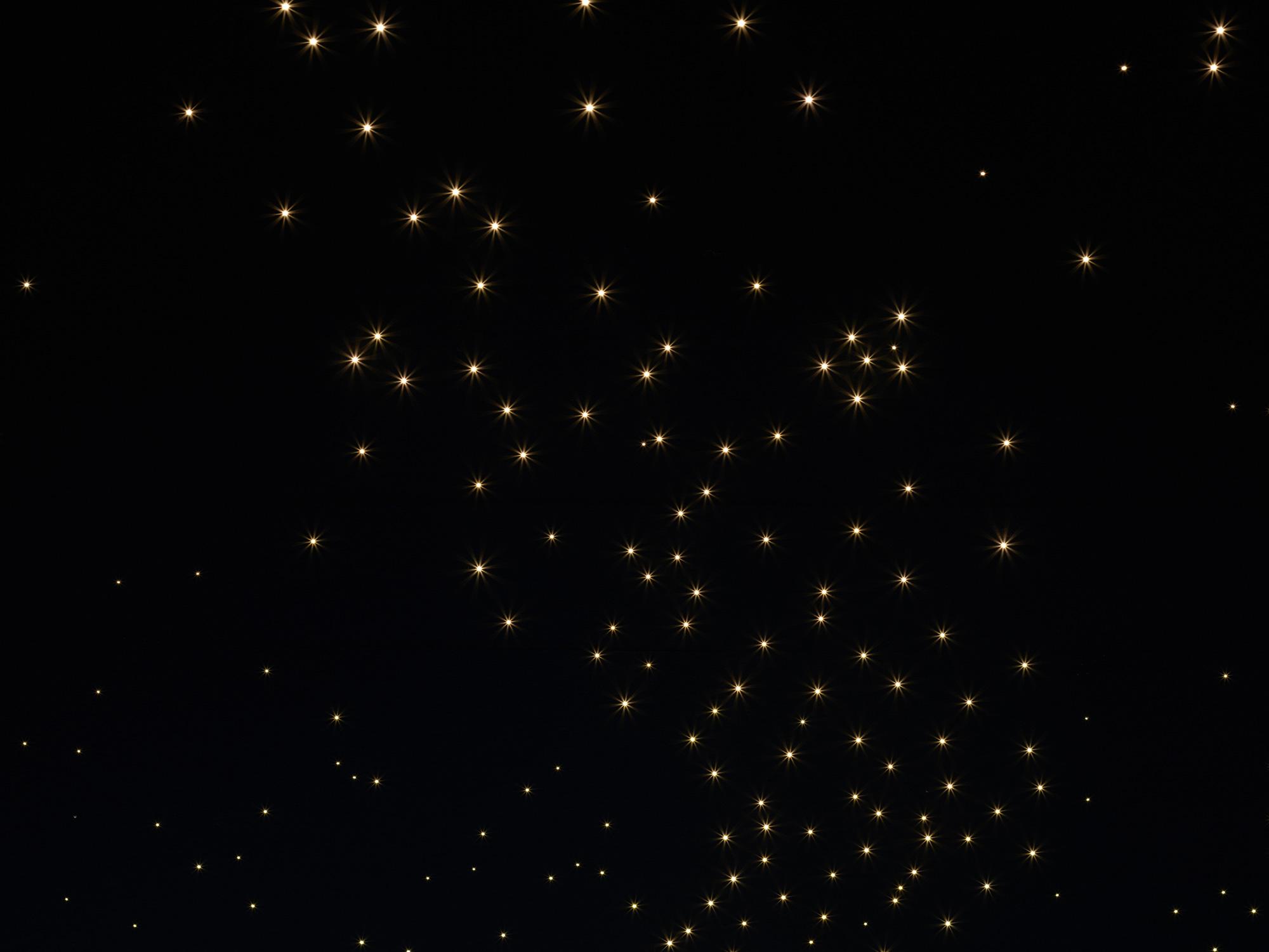 Close-up of Acosorb starry acoustic ceiling with warm glowing light points